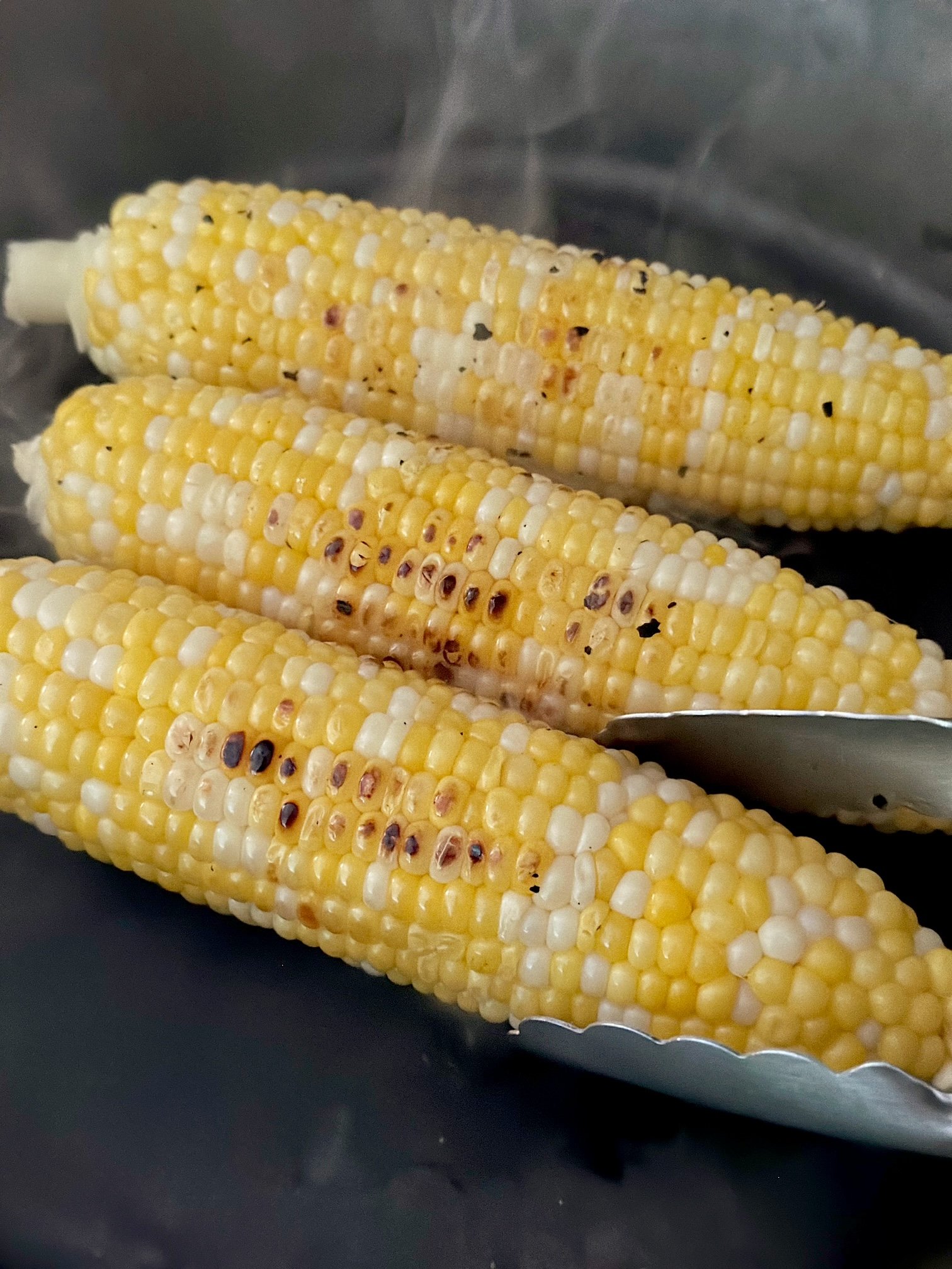 Nice golden sear on the corn on the cob in a cast iron skillet.